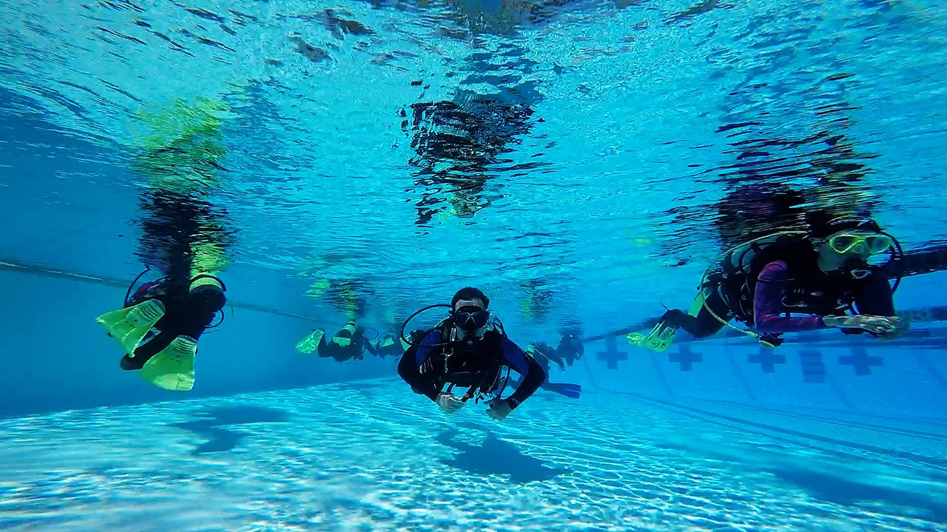 UCF Students practicing in a pool.